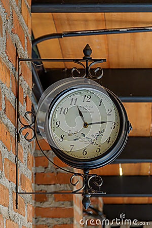 antique hanging clock in vintage cafe Editorial Stock Photo