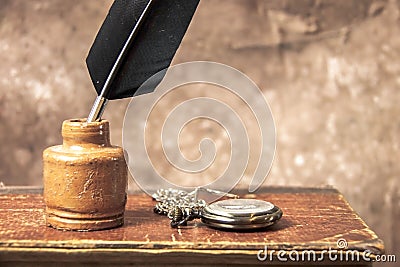 Antique inkwell and quill pen Stock Photo