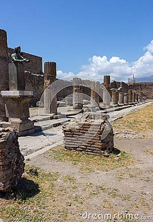 Antique italian square with ruins and columns and monument in Pompeii, Italy. Ancient forum concept. Editorial Stock Photo