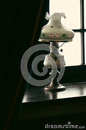 antique lamp behind a curtain Stock Photo