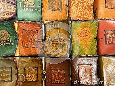 Antique leather-bound books handmade in a vintage shop in Tallinn tourist souvenirs Editorial Stock Photo