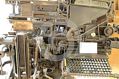 PorAntique linotype machine in the museum Editorial Stock Photo