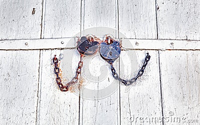 Antique locks and chain on wood Stock Photo