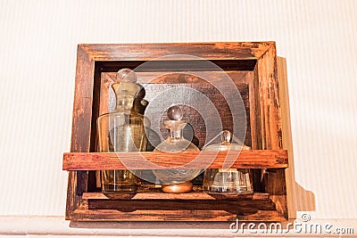 Antique medicinal glass bottles in antique cabinet Stock Photo