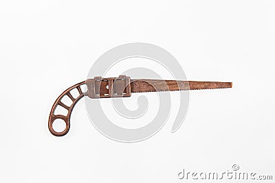 Antique miniature metal saw on a white background - center Stock Photo