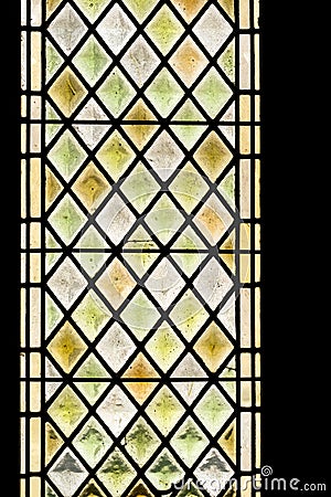 Multicolored medieval stained glass window panel Stock Photo