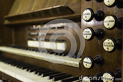 Antique organ manual stops wood Stock Photo