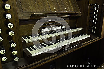 Antique organ manual stops wood Stock Photo