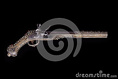 Antique ornate musket pistol firearm on black background Stock Photo