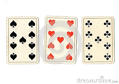 Antique playing cards showing three nines. Stock Photo