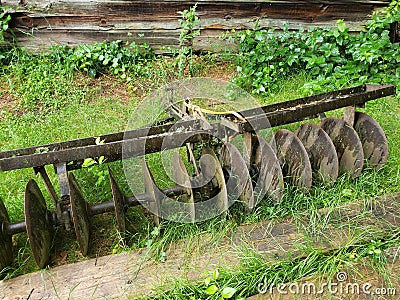 Antique plow parts Grist mill pond Stock Photo