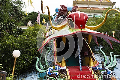 Antique red stairs of Chinese Dragon Tunnel to Ku Ha Mangkorn Sawan or Bua Kli Cave of Wat Ban Tham temple for thai people travel Editorial Stock Photo