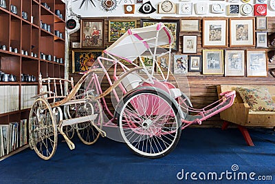 Antique rickshaw and tricycle in the vintage warehouse gallery. Editorial Stock Photo