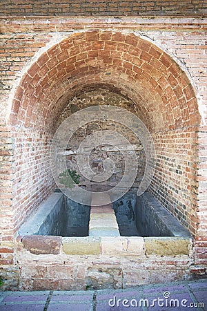 Antique Roman public laundry runes in Caldes de Montbui, Barcelona, Catalonia. Touristic landmark destination Stock Photo
