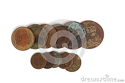 Antique round dirty coins lie on a white background. Stock Photo