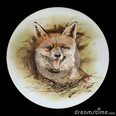 Antique round plate with the image of foxes. round picture for decoupage with animals. Editorial Stock Photo