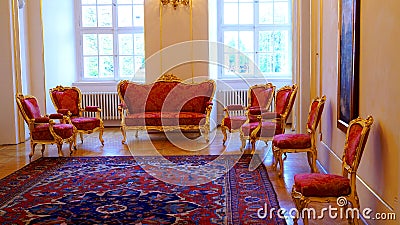 Antique royal furniture sofa and armchairs in the interior of Prague Castle in Prague Editorial Stock Photo