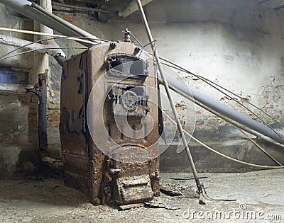 Antique rusted cast iron central heating boiler Editorial Stock Photo