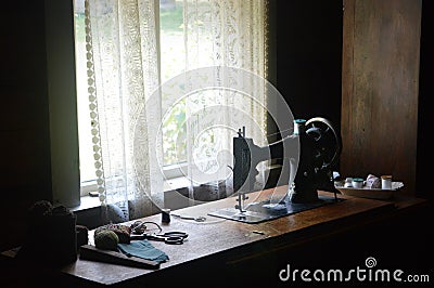 Antique Sewing Machine and Sewing Notions Stock Photo