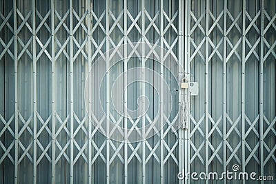 Antique slide steel locked shutter door, texture background Stock Photo