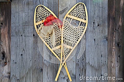 Antique Snowshoes on a Weathered Wood Barn Wall Stock Photo