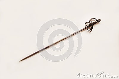 Antique steel rapier with a beautiful handle isolated on a white background, France. Cold weapons, duels Stock Photo