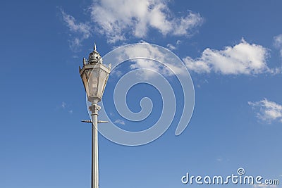 Antique street lamp with openwork ornament against the sky Stock Photo