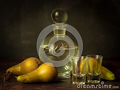 Antique-style still life with pears and alcohol. Stock Photo