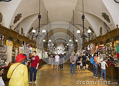 antique Sukiennice market place inside architecture with tourist and small gift shops Editorial Stock Photo