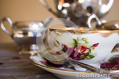 Antique teacup and silver tea set Stock Photo