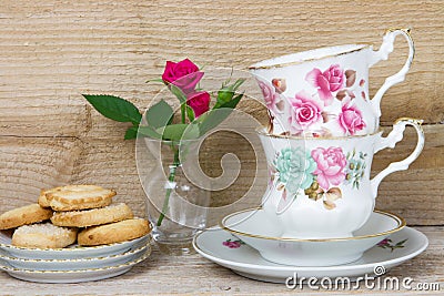 Antique teacups and cookies Stock Photo
