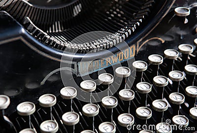 Antique typewriter from beginning 20th century at industry exhibit in an art gallery Editorial Stock Photo