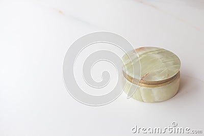Antique vintage casket of green onyx with gold jewelry on a white background. text space Stock Photo
