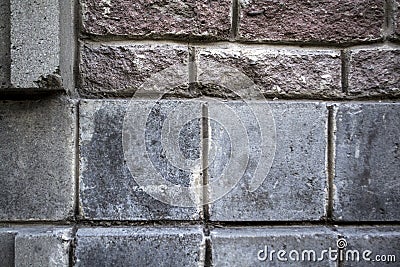 Antique wall made of different bricks Stock Photo