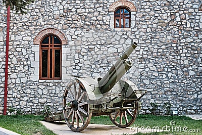 Historical Canon on Display, Kalavryta Church, Peloponnese, Greece Stock Photo