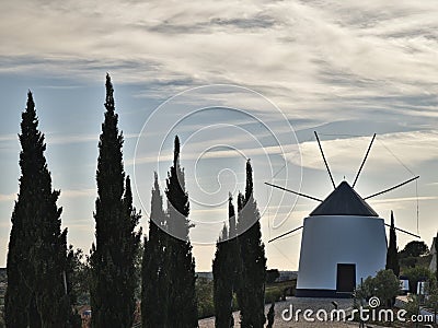 Antique windmill and trees Stock Photo