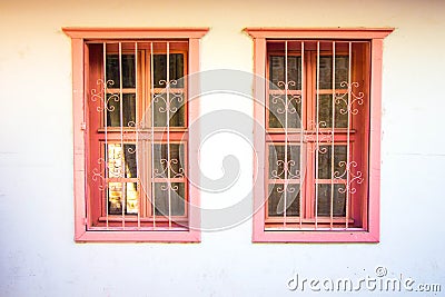 Antique windows in a pink hue Stock Photo