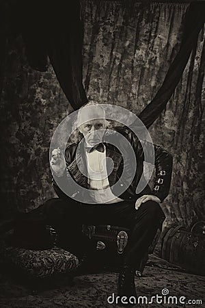 Antiqued steampunk portrait of man sitting in studio Stock Photo