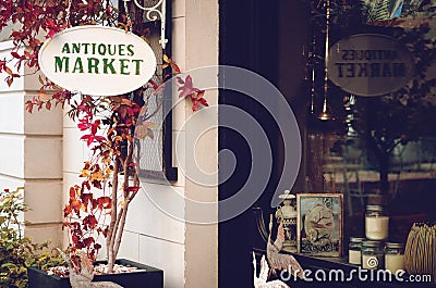 Antiques shop signboard adn front window Stock Photo