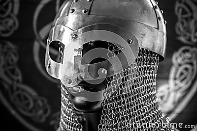 antivirus or firewall concept, Viking warrior helmet with chainmail over silver shield Stock Photo