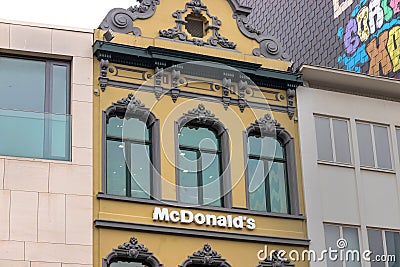 Mc donalds sign on an building in antwerp belgium Editorial Stock Photo