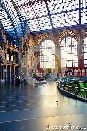 Antwerp, Belgium - June 2019: Interior of Antwerp Central Train station with sun shining through the glass windows Editorial Stock Photo