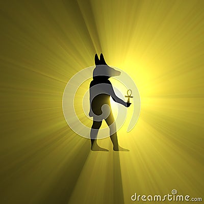 Anubis holding Ankh Egyptian symbol light flare Stock Photo