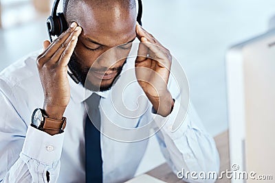 Anxiety, burnout and headache by consultant worker, customer service and call center employee in office. Pain, mental Stock Photo