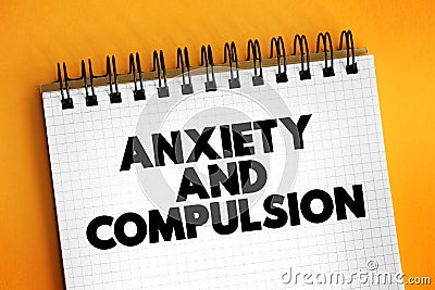 Anxiety and Compulsion text concept on notepad for presentations and reports Stock Photo