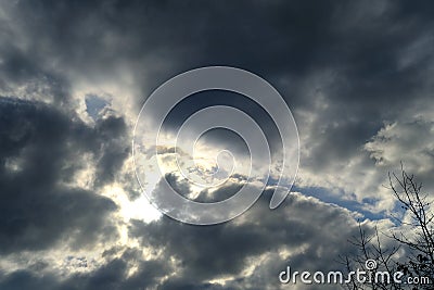anxious dramatic landscape, echanges in weather, blue sky with white and dark clouds, concept of transcendence, Heaven and Stock Photo