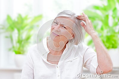 Senior woman thinning hair loss Stock Photo