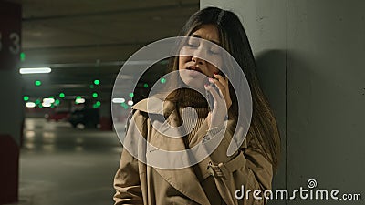 Anxious upset Asian woman chinese korean girl japanese businesswoman talk mobile phone outside car parking calling Stock Photo