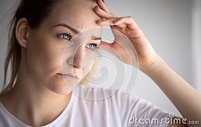 Anxious, worried, stressed young woman Stock Photo