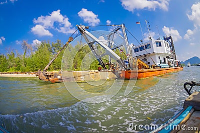 AO NANG, THAILAND - FEBRUARY 09, 2018: Outdoor view of huge boat with a ramp, sailing in the river at with a blurred Editorial Stock Photo